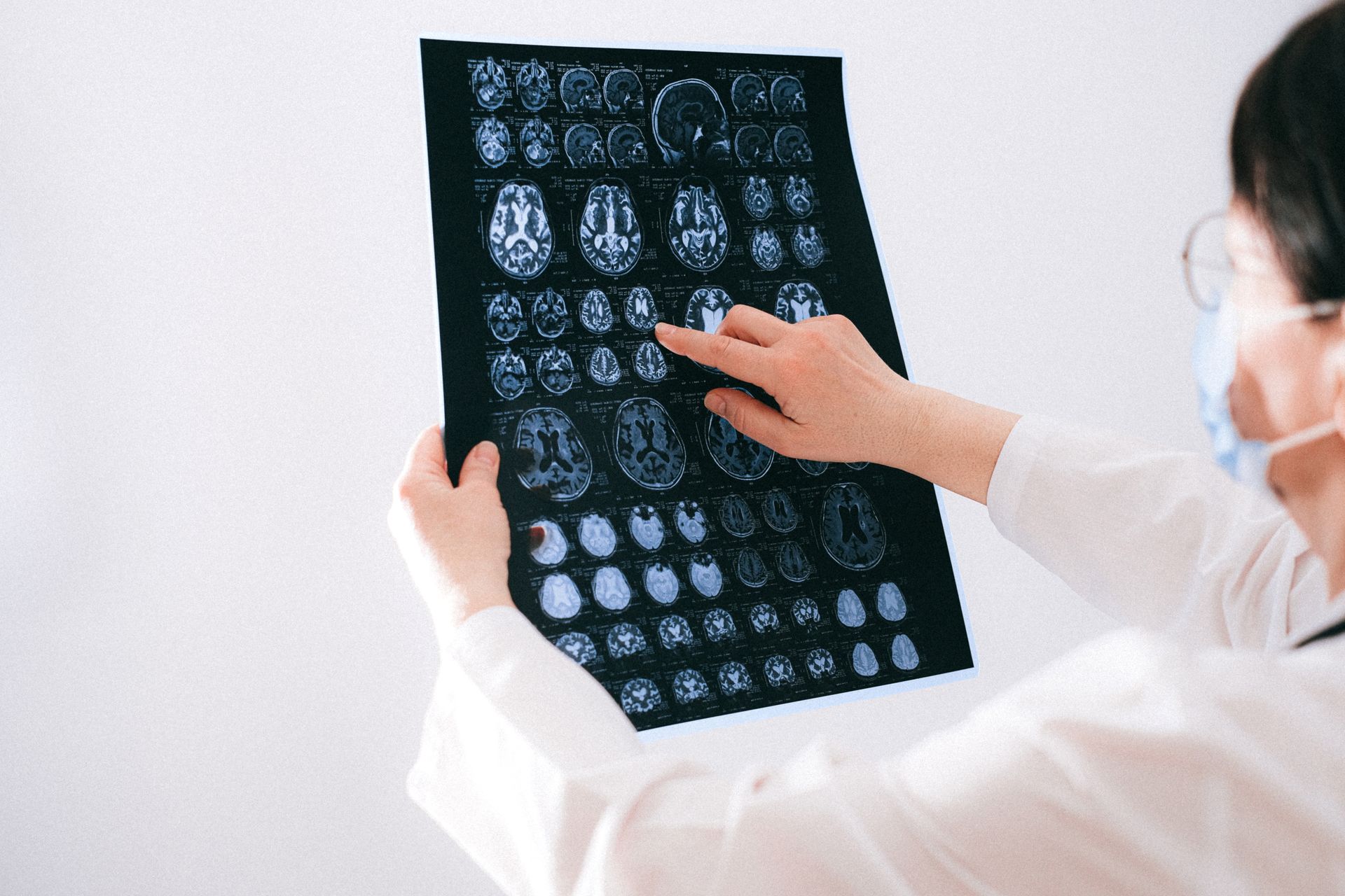 Doctor explaining brain scan or hormones to patient