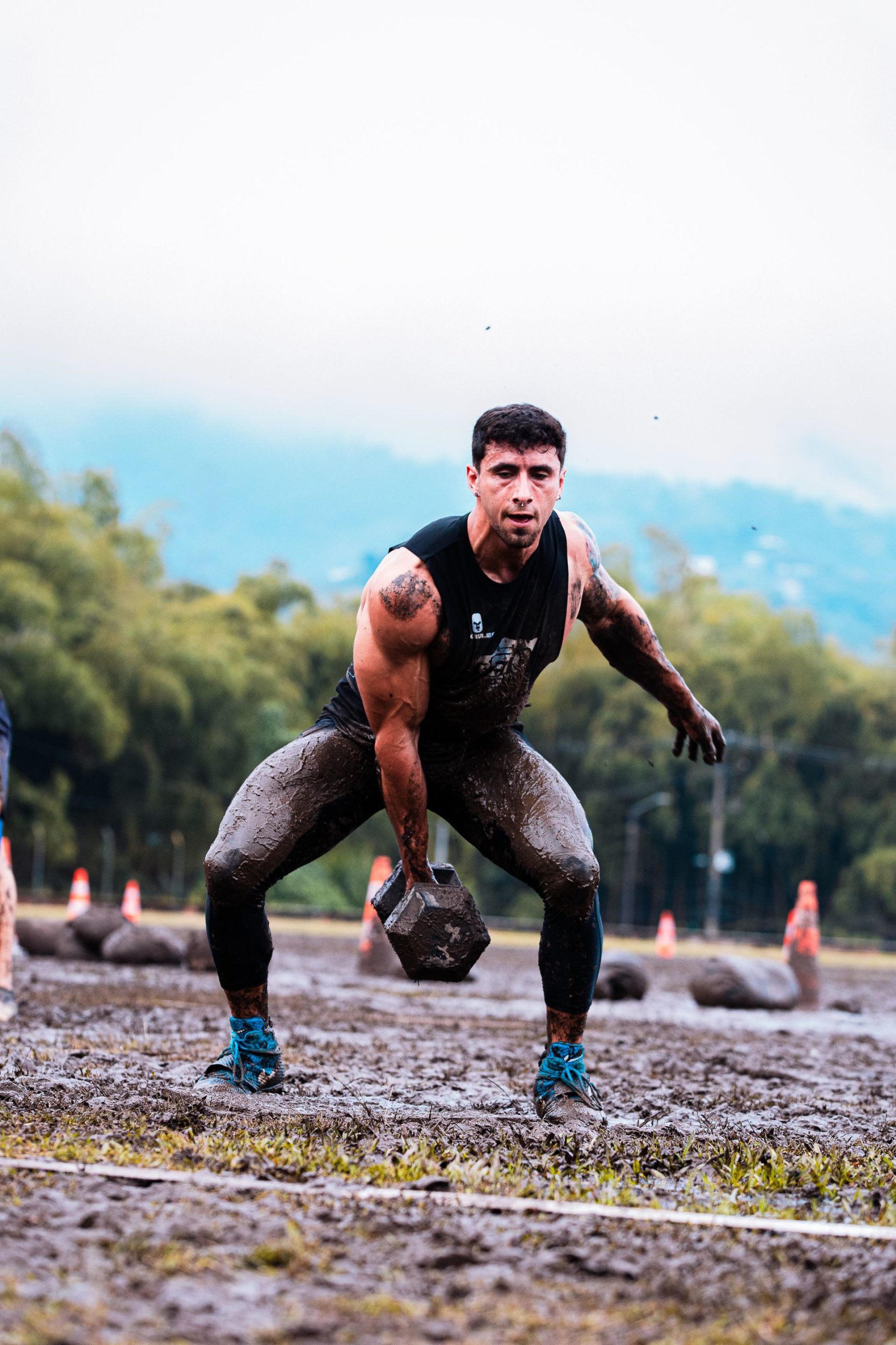 Man strength training in a gym while researching TRT and muscle gain